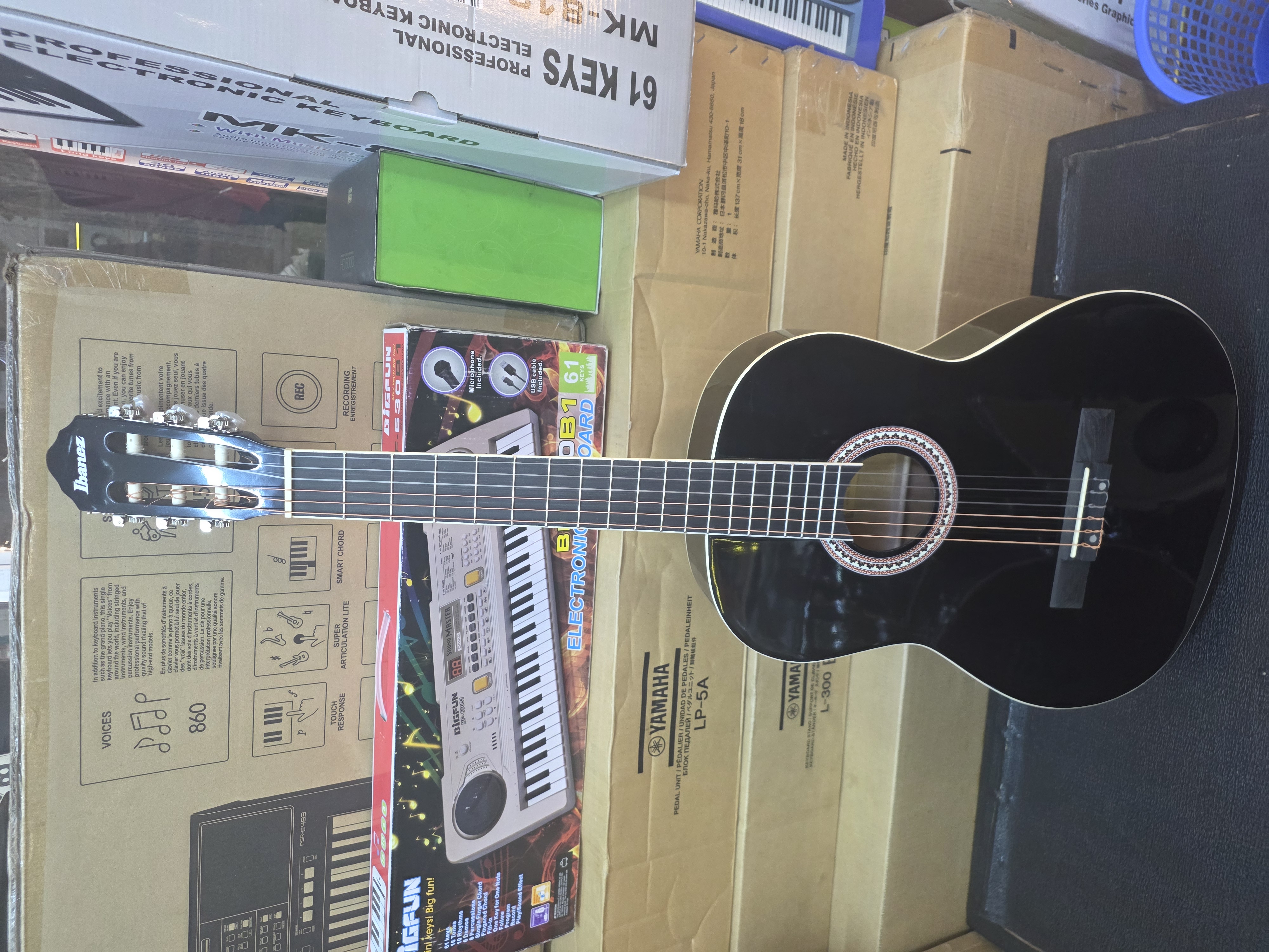 Ibanez full-size classical guitar with nylon strings and natural wood finish.