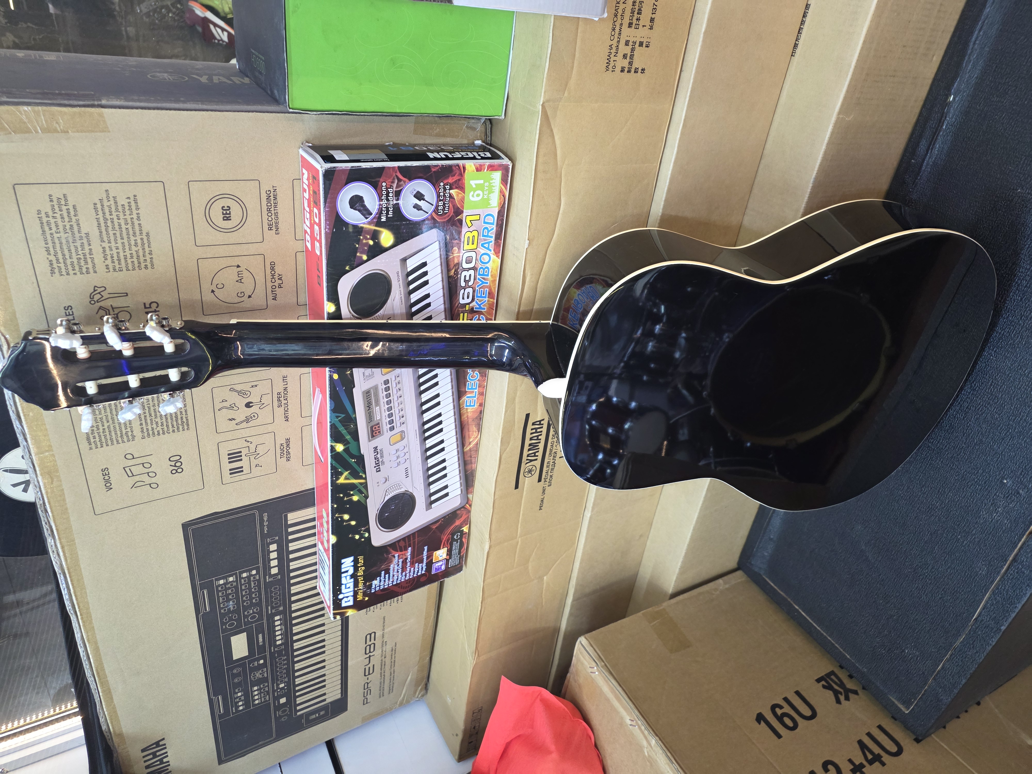 Ibanez full-size classical guitar with nylon strings and natural wood finish.