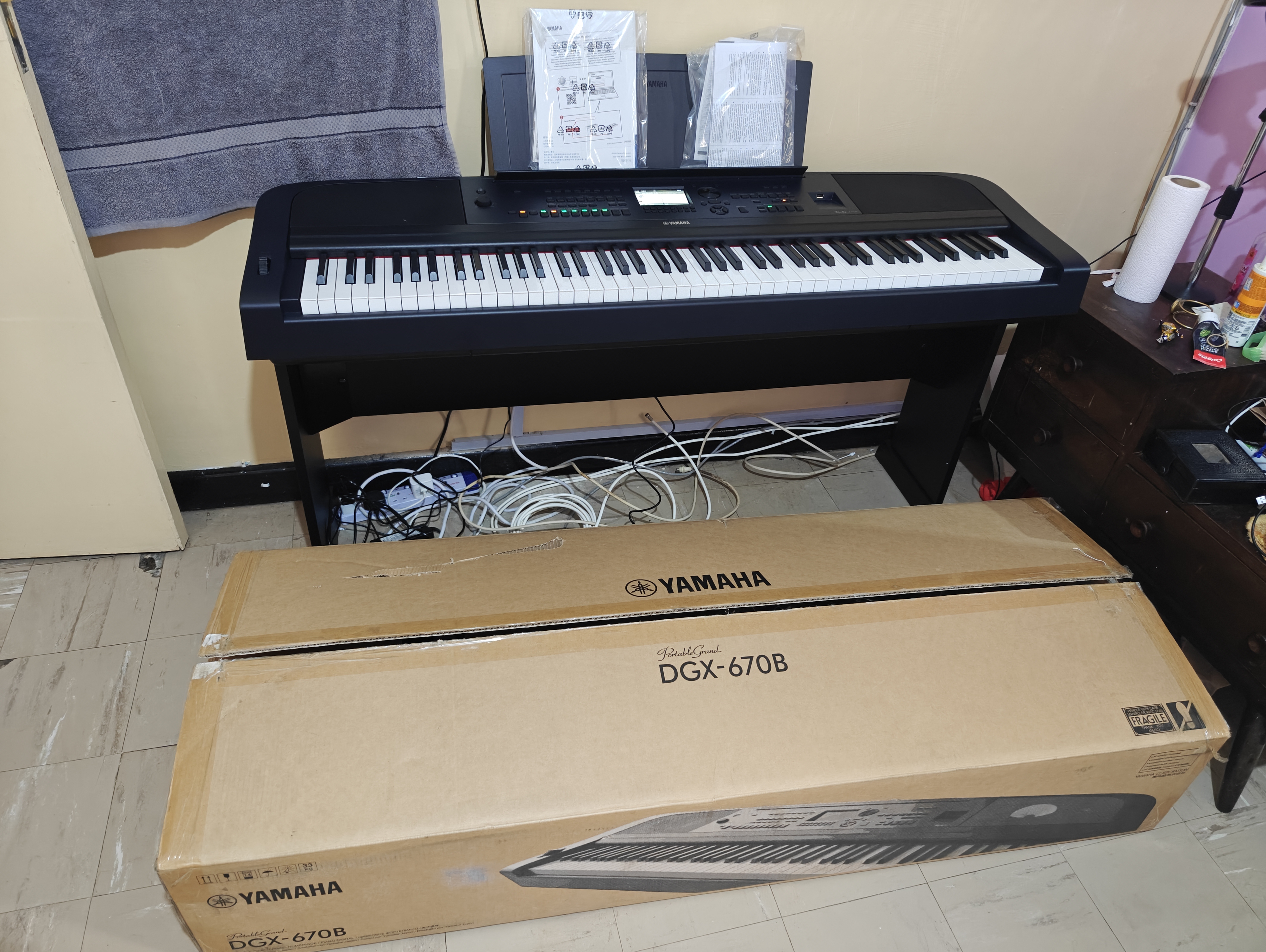 Yamaha DGX-670B 88-key weighted digital piano in black with GHS keyboard and LCD display