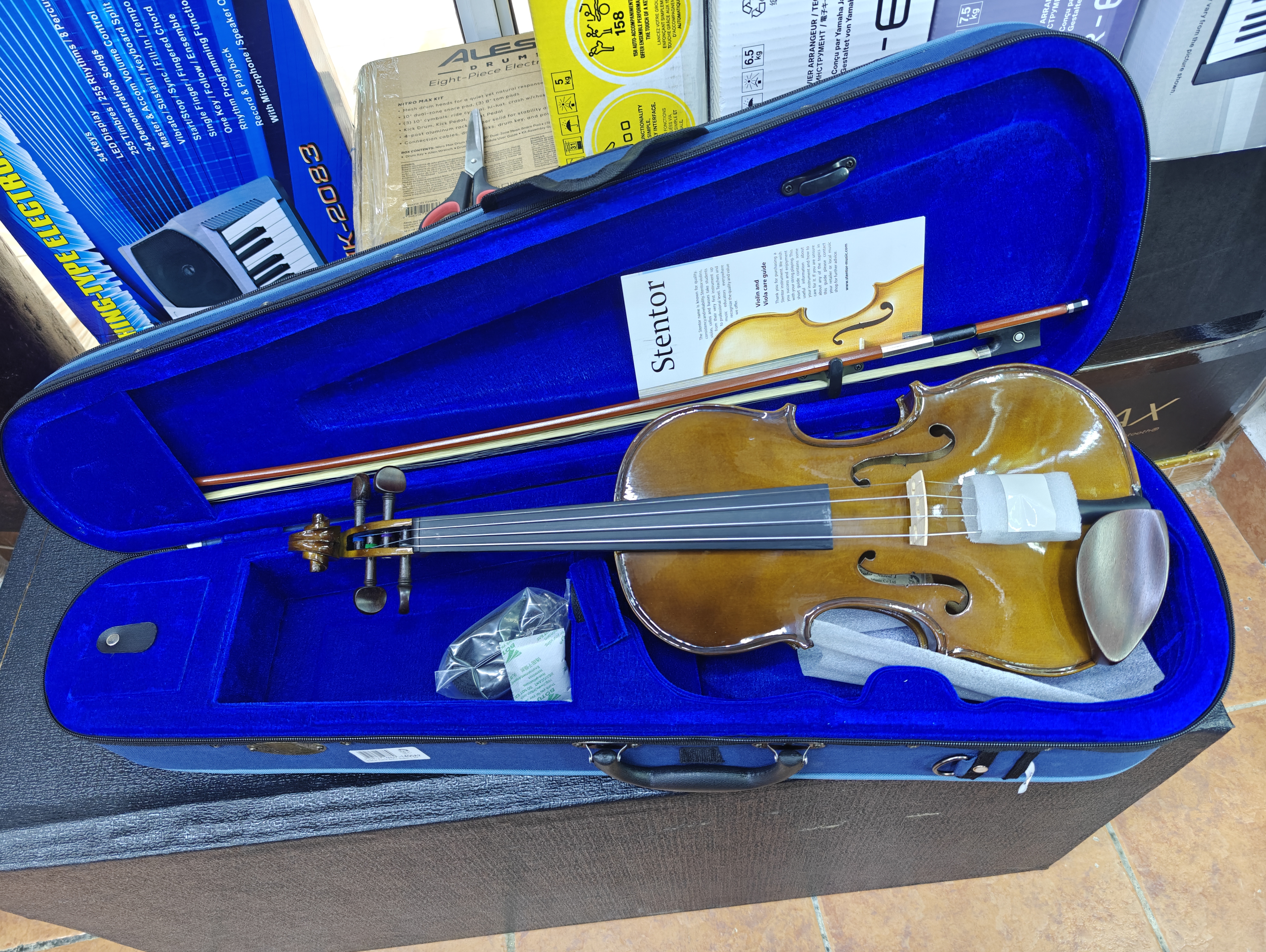 Buy the Stentor 1400A Violin Outfit, a high-quality beginner violin with a solid spruce top, maple body, wooden bow, protective case, and rosin. Perfect for students and school orchestras.